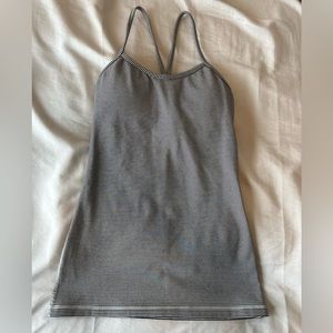 Lululemon tank top. Size 4. Black striped tank.